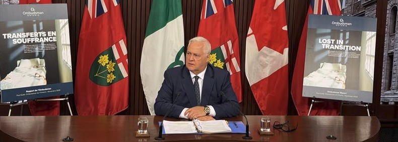 Paul Dubé at press conference for the release of his report, Lost in Transition