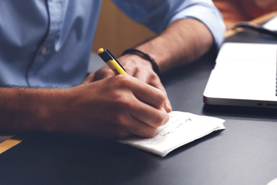 Hand writing on a piece of paper