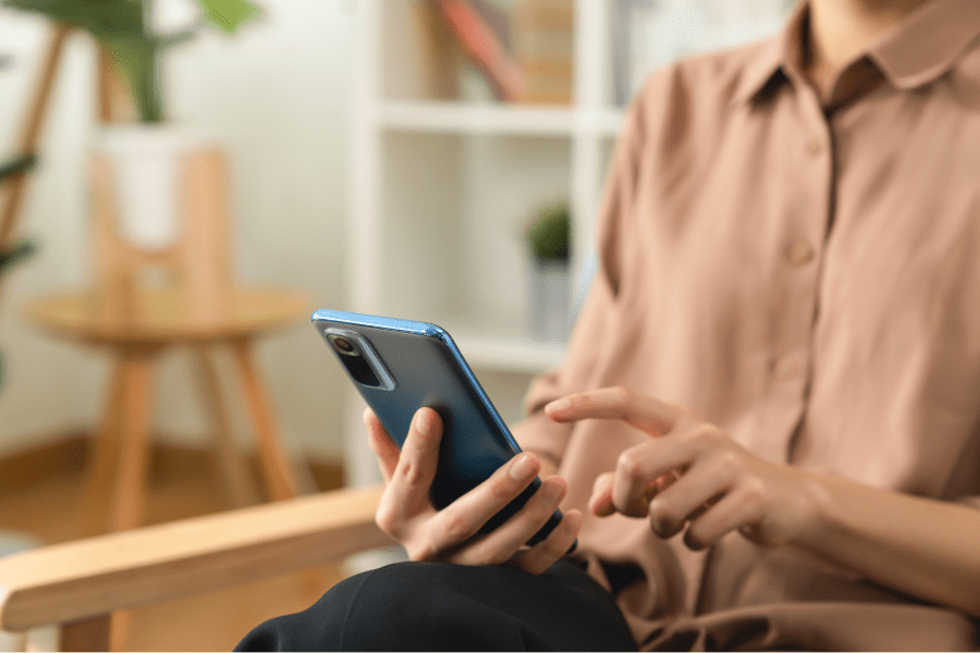 Person tapping on a smartphone