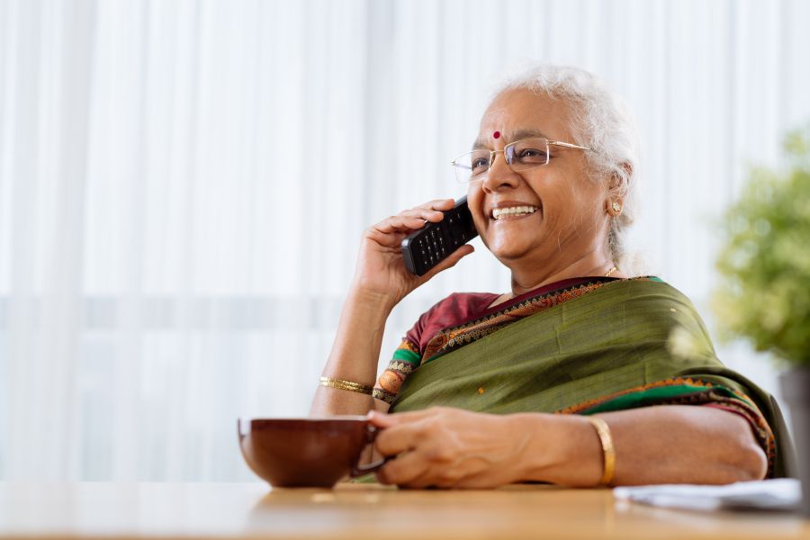 Woman smiling while talking on phone